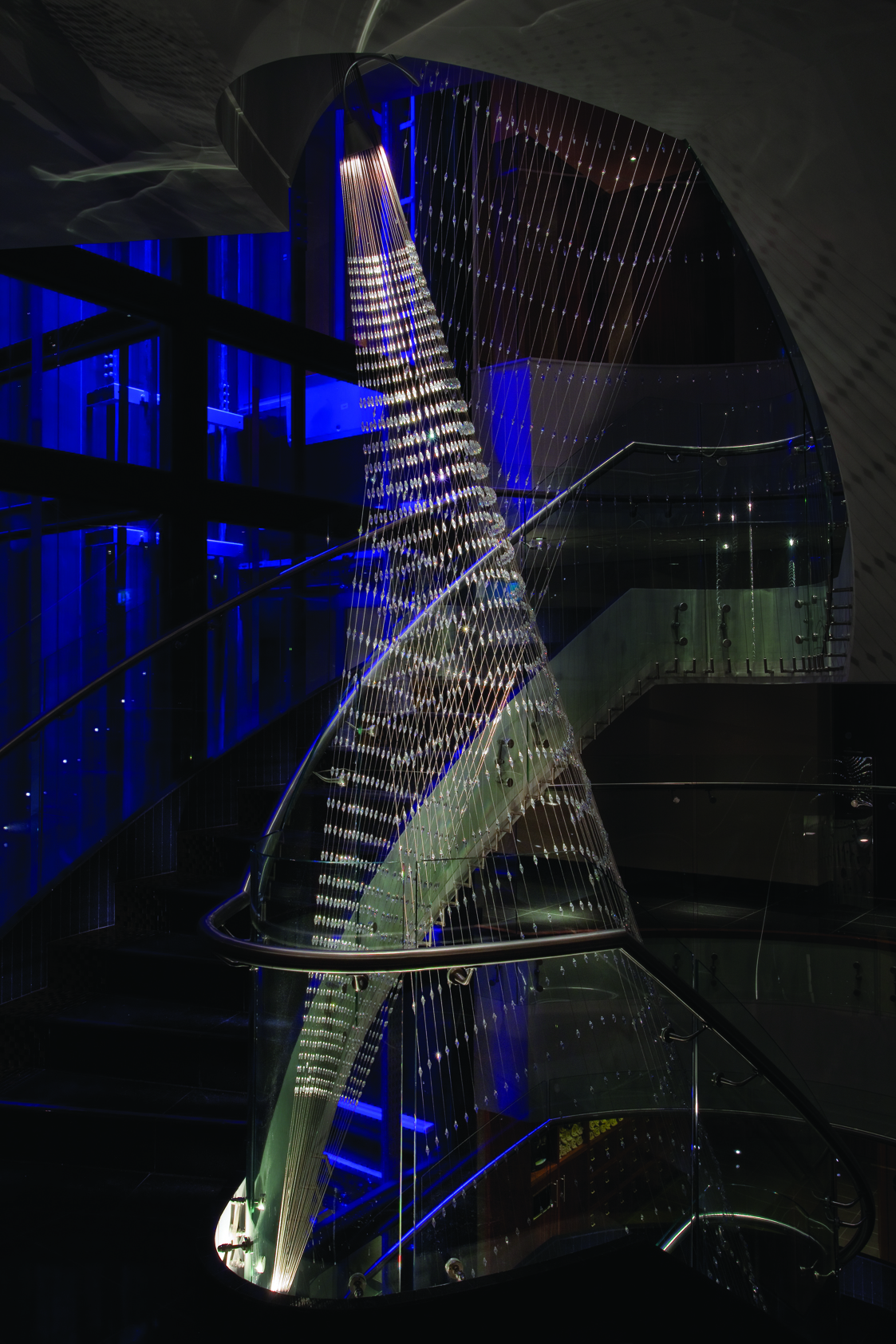 spiral stairs going up with lights spiriling downards