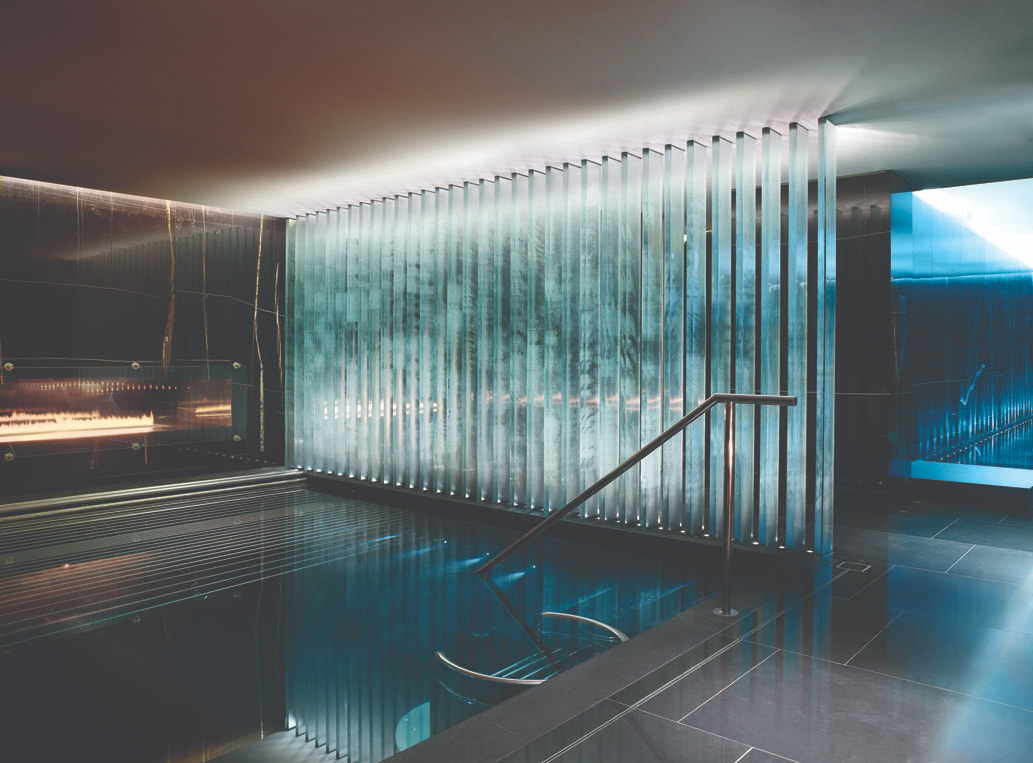 indoor pool surrounded by glass walls